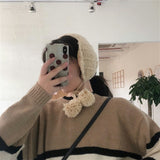 ボンボンケーブルニットイヤーマフ