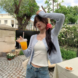 ゴールドボタンケーブルカーディガン