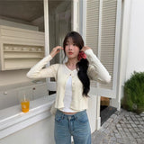 ゴールドボタンケーブルカーディガン