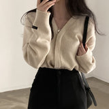 インボタンカーディガン