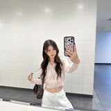 パウダーピンクケーブルニット