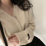 インボタンカーディガン