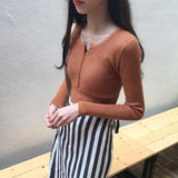 ボタンネックリブトップス