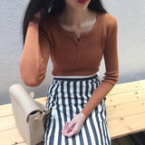 ボタンネックリブトップス