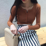 ボタンネックリブトップス