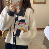 ボタンカラーリブトップス