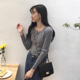 ボタンネックリブトップス