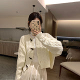 ボタンアクセントケーブルカーディガン