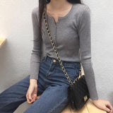 ボタンネックリブトップス