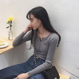 ボタンネックリブトップス