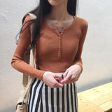 ボタンネックリブトップス