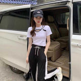 サイドバックルスリットTシャツ