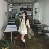 ネックタイクリームカーディガン