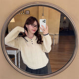 リボン刺繍ケーブルポロニット